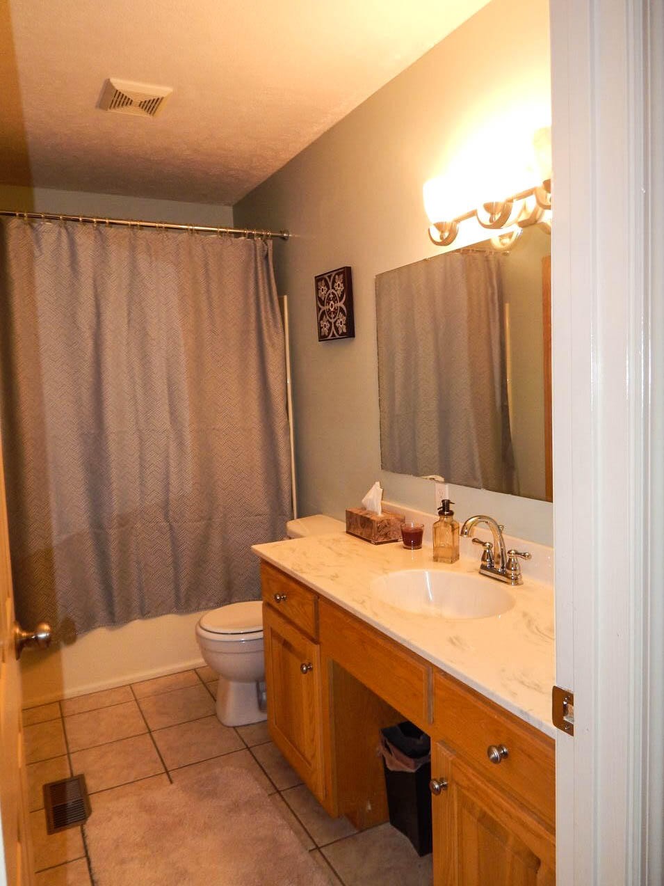1660 Dutch Valley Road Clinton, TN 37716 - Photo 24 of 33 a bathroom with a sink a toilet and shower