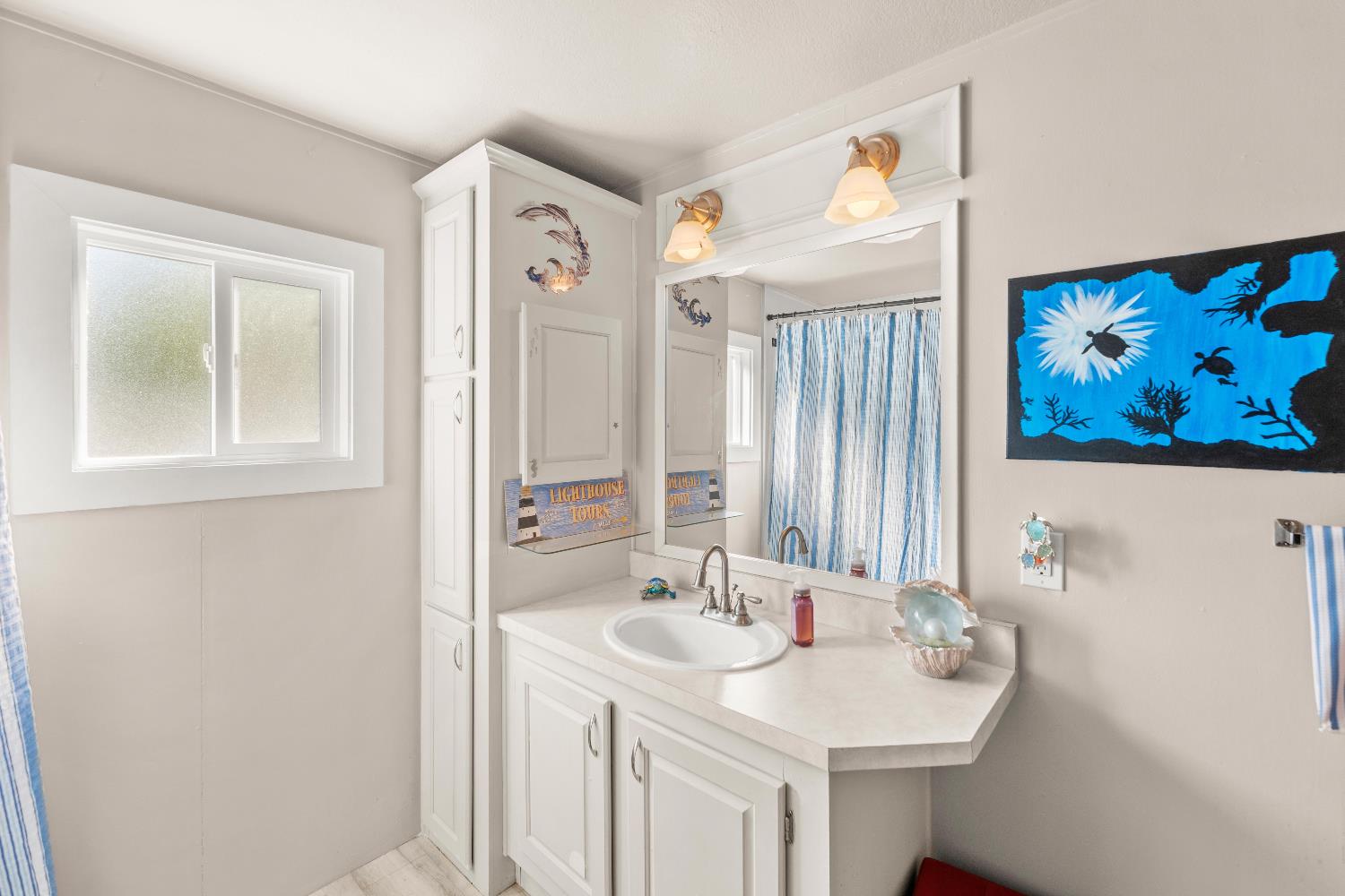 135 Ponderosa Way, Unit 2 Colfax, CA 95713 - Photo 21 of 33 a bathroom with a sink and a mirror