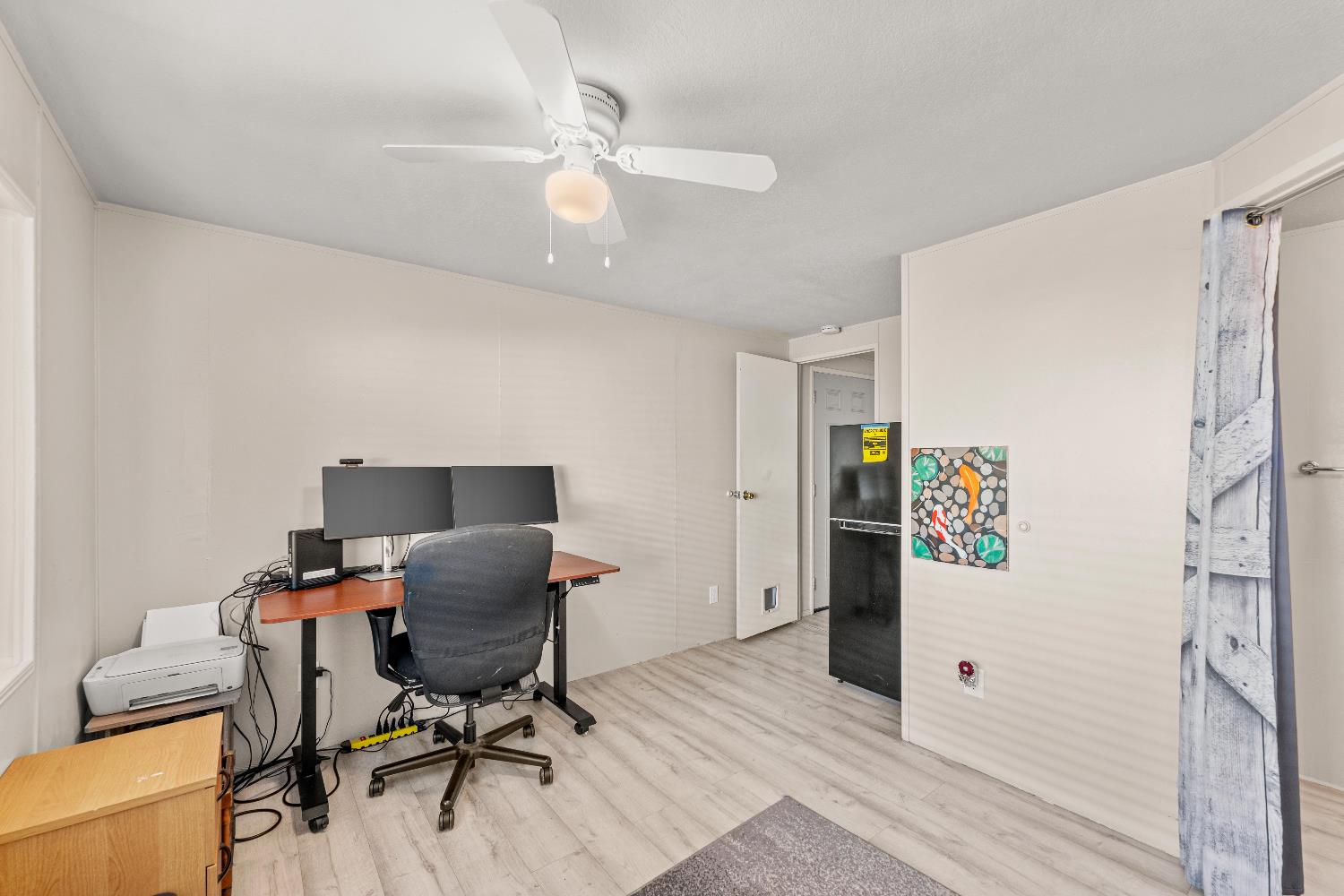 135 Ponderosa Way, Unit 2 Colfax, CA 95713 - Photo 23 of 33 a workspace with furniture and wooden floor