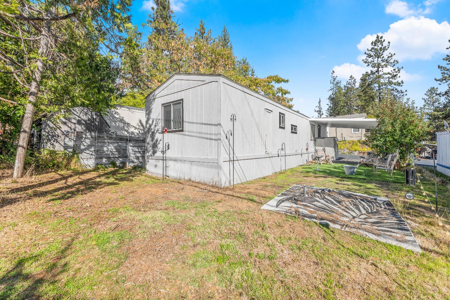 135 Ponderosa Way, Unit 2 Colfax, CA 95713 - Photo 7 of 33 a white house that has a tree in front of it