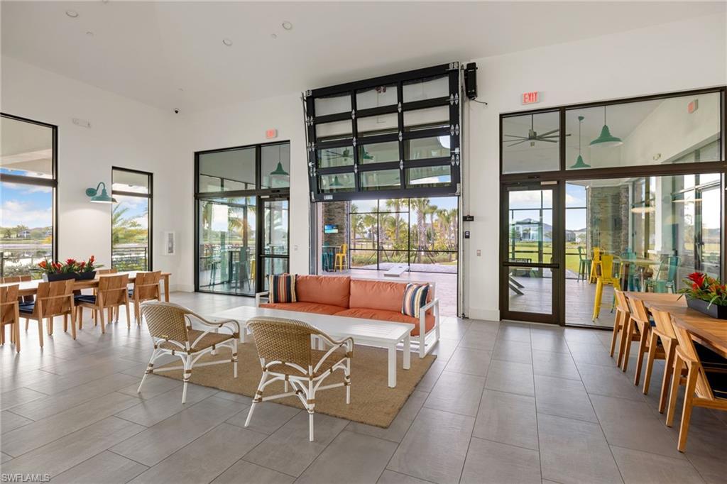 3967 Pegasus Way Naples, FL 34120 - Photo 45 of 50 a living room with furniture and a large window