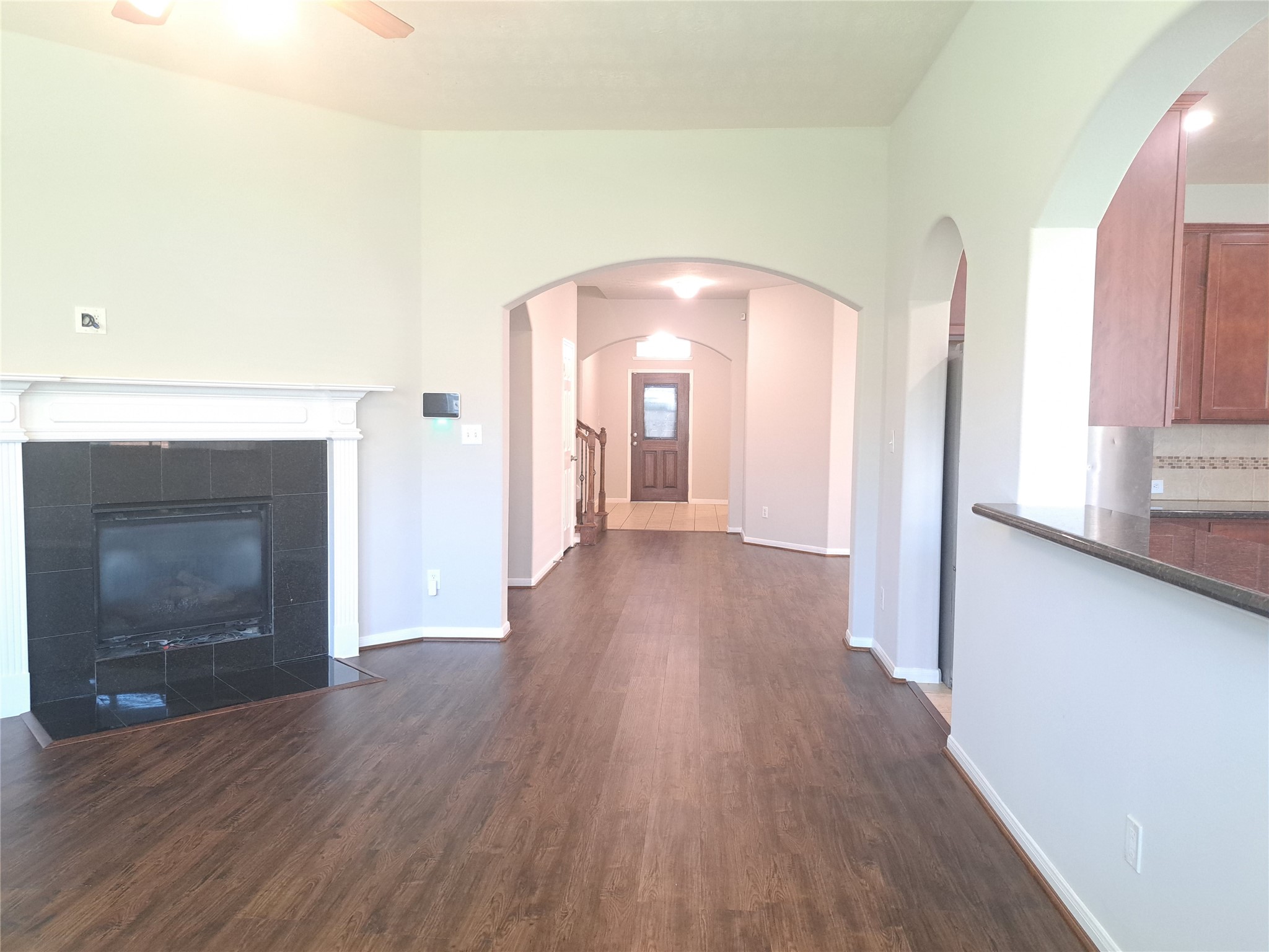 26315 Fox Ridge Lane Katy, TX 77494 - Photo 13 of 39 a view of a room with wooden floor and fireplace