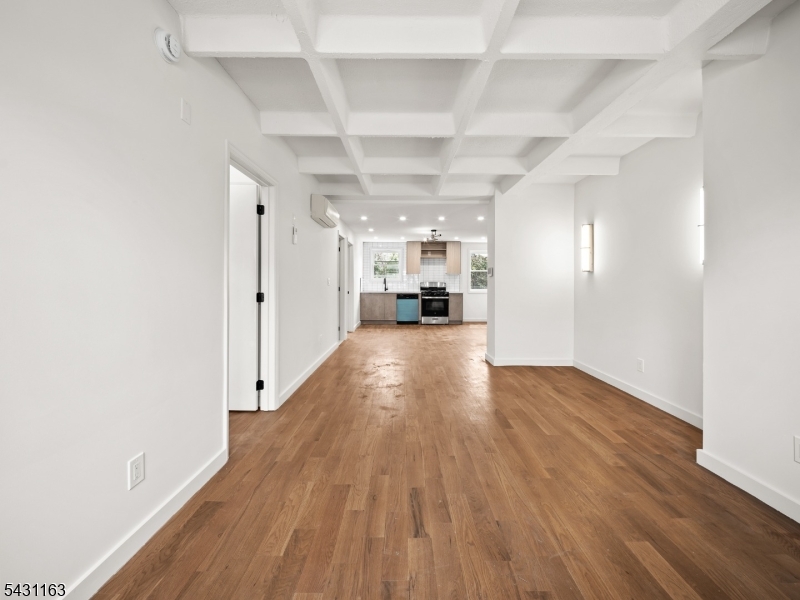 100 Chestnut Street, Unit 3 West Orange, NJ 07052 - Photo 6 of 18 a view of empty room with wooden floor