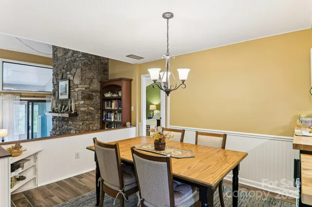 a dining room with furniture and window