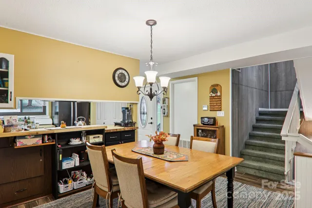 a kitchen with stainless steel appliances granite countertop a refrigerator stove and sink