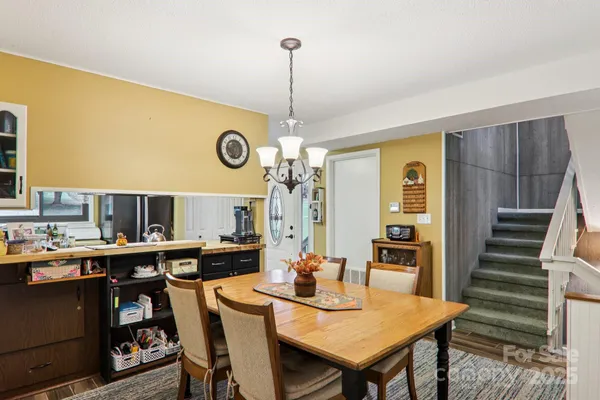 a kitchen with stainless steel appliances granite countertop a refrigerator stove and sink