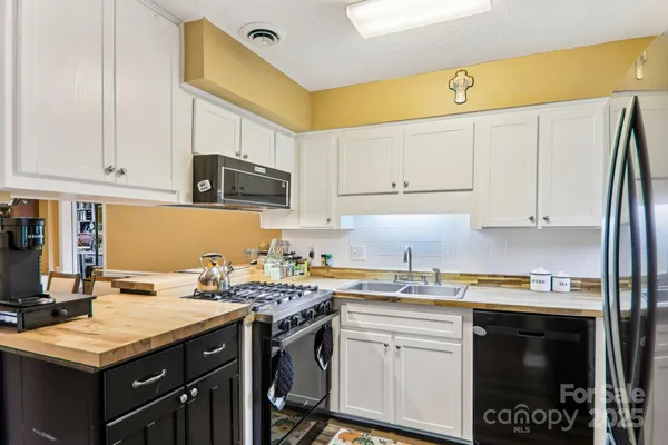 a bedroom with a bed and a table