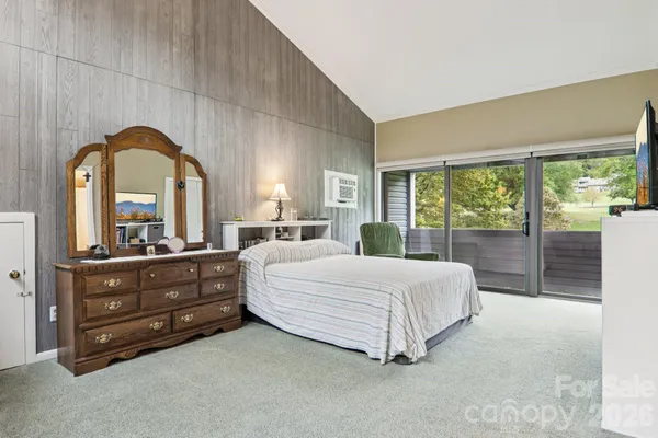 a dining room with furniture water view and a large window