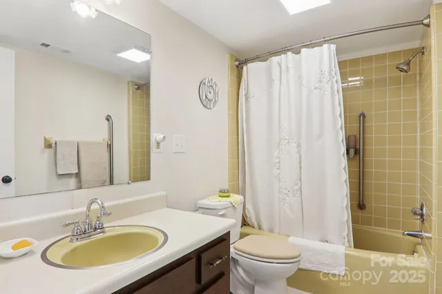 a dining room with furniture water view and a large window