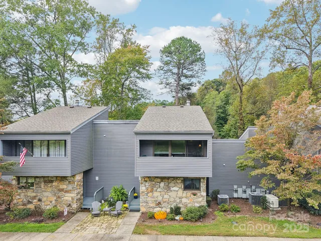 a house with trees in the background