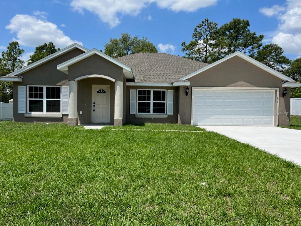 579 Northwest Ridgewood Road Dunnellon, FL 34431 - Photo 1 of 58 a front view of house with yard and green space