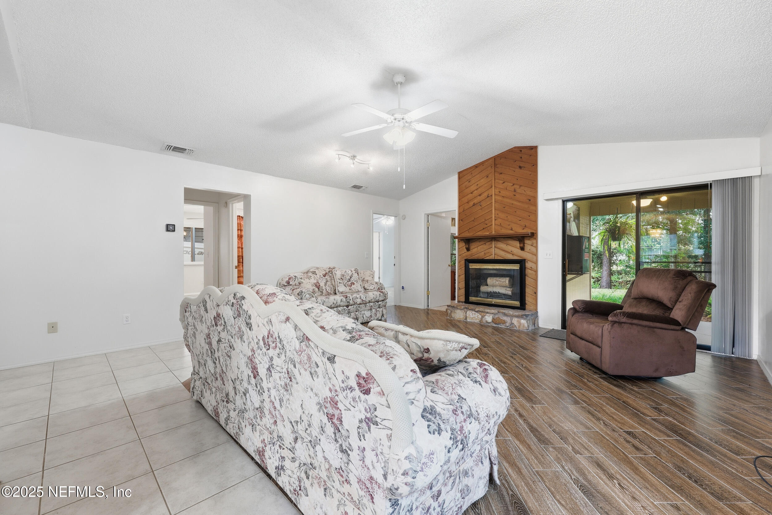 1828 Killarn Circle Middleburg, FL 32068 - Photo 13 of 28 a living room with furniture and a fireplace
