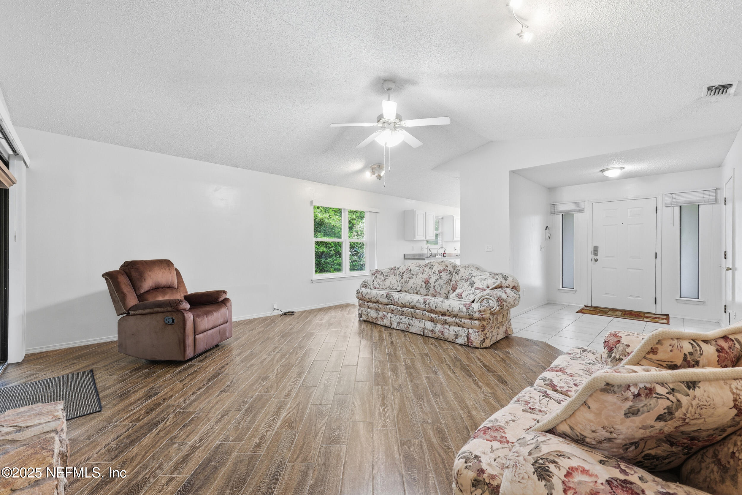 1828 Killarn Circle Middleburg, FL 32068 - Photo 14 of 28 a living room with furniture and a wooden floor