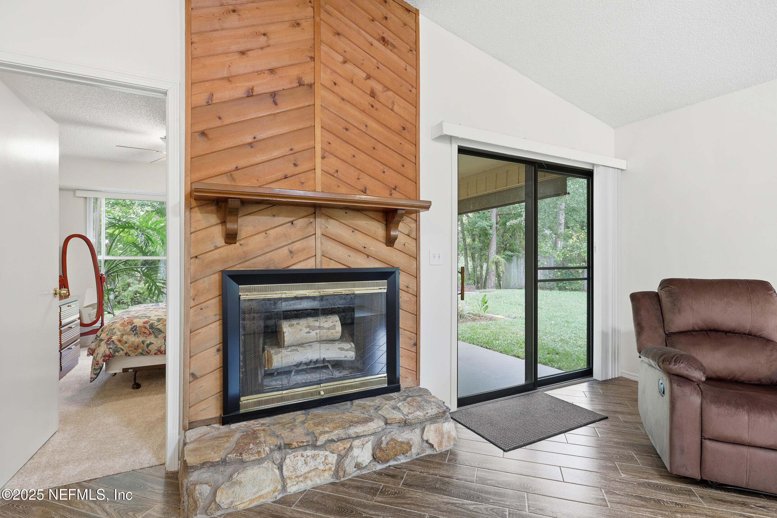 1828 Killarn Circle Middleburg, FL 32068 - Photo 15 of 28 a living room with furniture and a fireplace