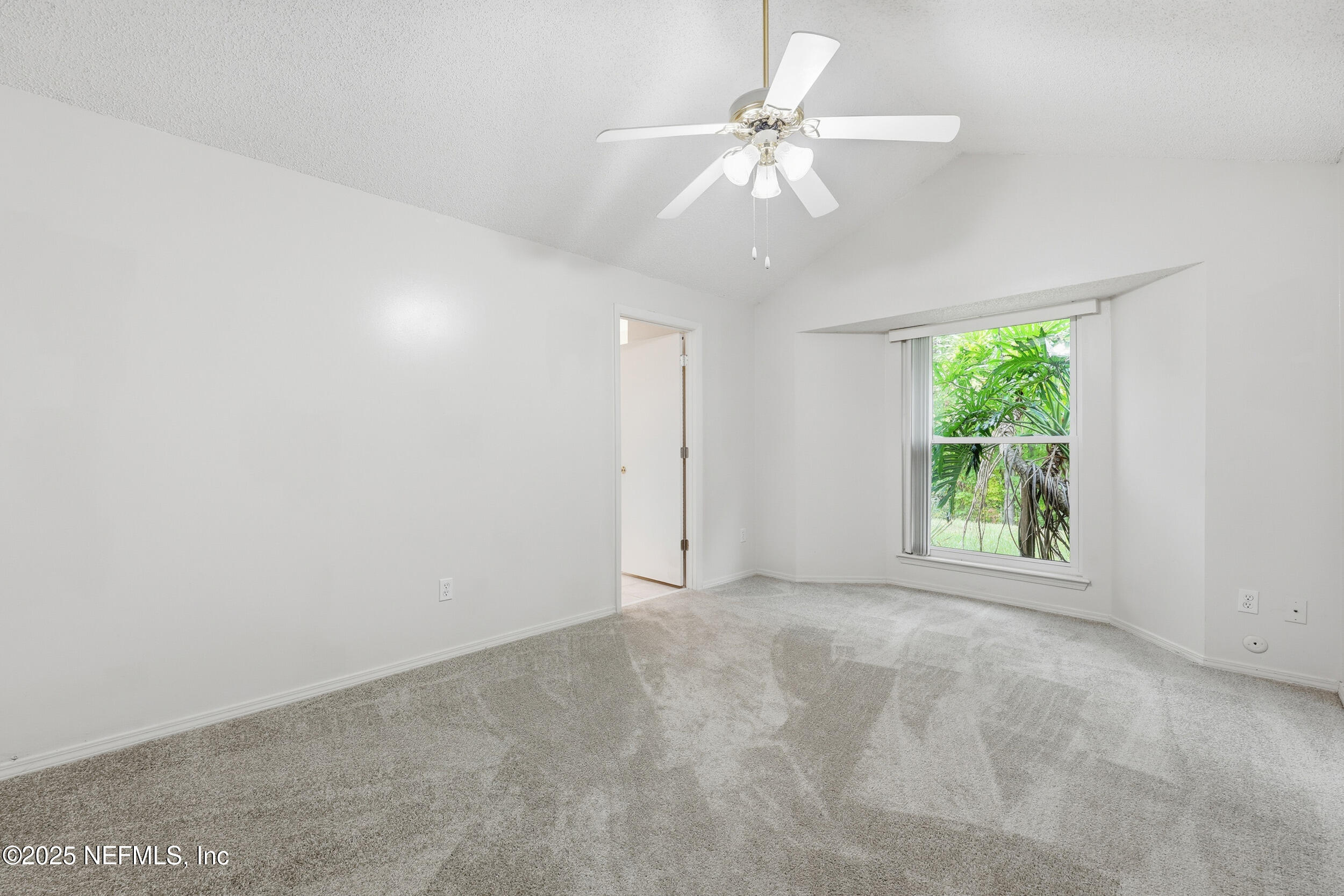 1828 Killarn Circle Middleburg, FL 32068 - Photo 21 of 28 wooden floor in an empty room with a window