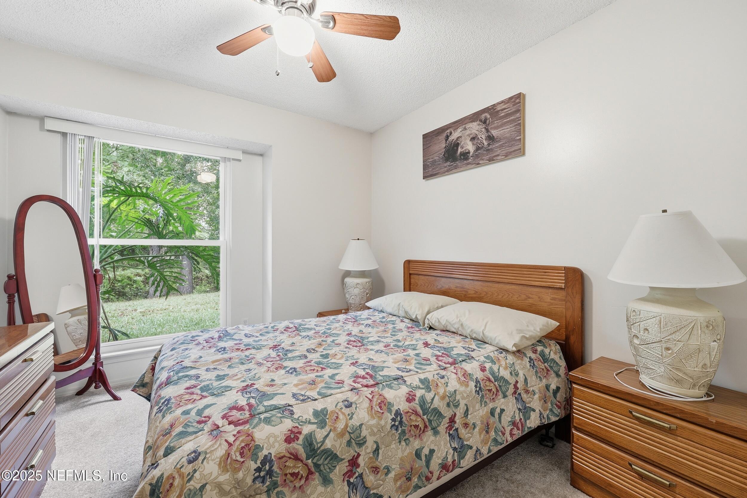 1828 Killarn Circle Middleburg, FL 32068 - Photo 25 of 28 a bedroom with a bed and a window