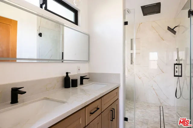 a bathroom with a sink and mirror
