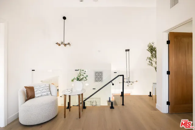 a view of hallway with furniture