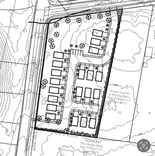 a picture of a room with a white walls and a window