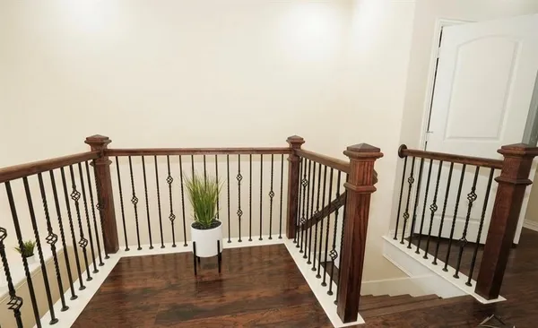 a view of a balcony with wooden floor
