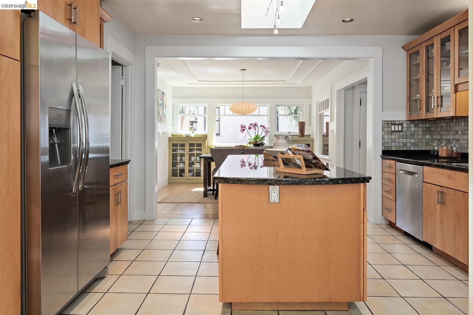 1950 Hopkins Street Berkeley, CA 94707 - Photo 11 of 57 a kitchen with stainless steel appliances granite countertop a refrigerator a stove and a sink with cabinets