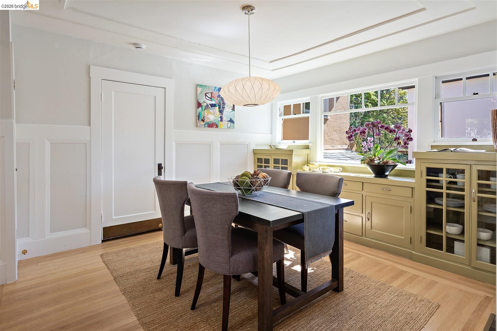 1950 Hopkins Street Berkeley, CA 94707 - Photo 12 of 57 a dining room with furniture window entryway and wooden floor