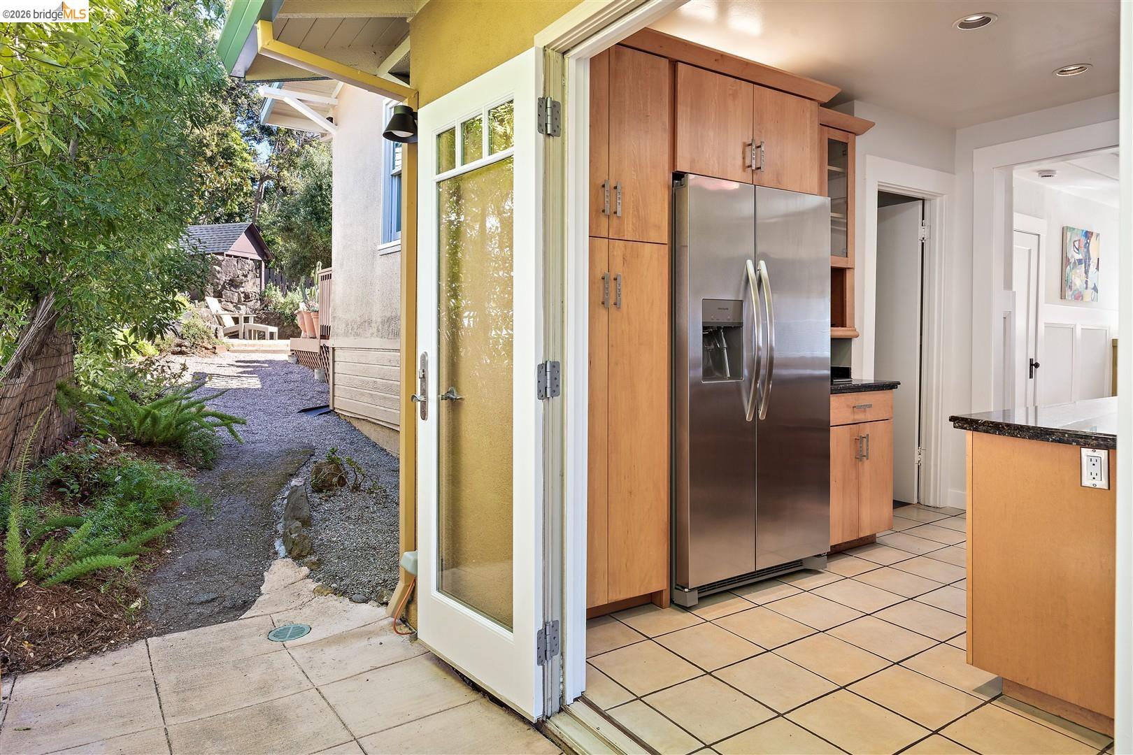 1950 Hopkins Street Berkeley, CA 94707 - Photo 21 of 57 a view of a refrigerator in kitchen and an empty room