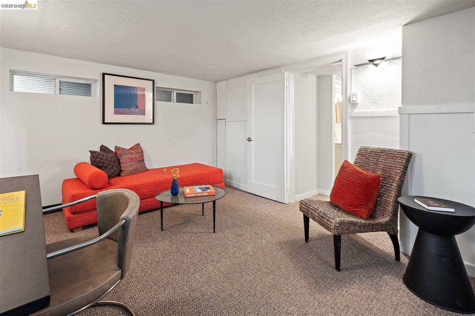 1950 Hopkins Street Berkeley, CA 94707 - Photo 23 of 57 a living room with furniture and a chair