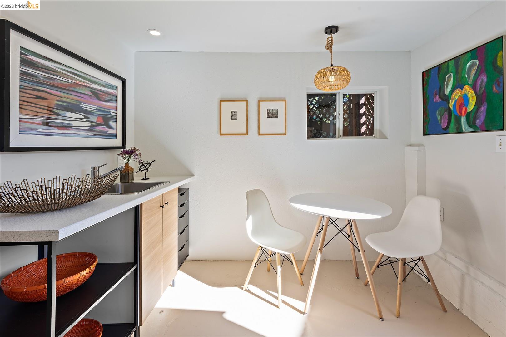 1950 Hopkins Street Berkeley, CA 94707 - Photo 28 of 57 a view of a dining room with furniture a chandelier and wooden floor