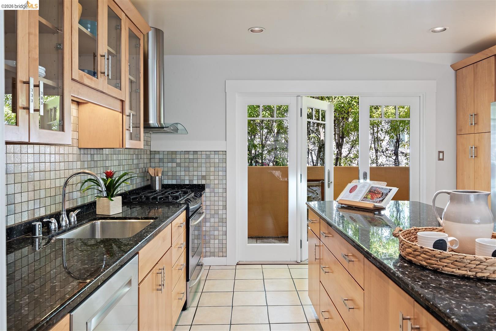 1950 Hopkins Street Berkeley, CA 94707 - Photo 9 of 57 a kitchen with granite countertop a sink and a counter