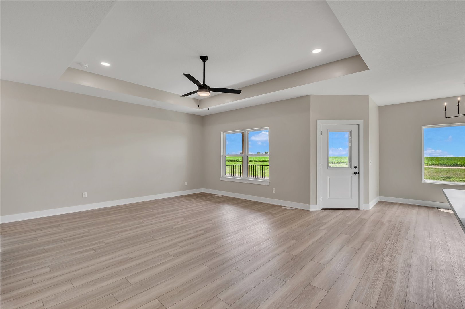 455 Rhonda Road New Liberty, IA 52765 - Photo 14 of 54 a view of an empty room with wooden floor and a window