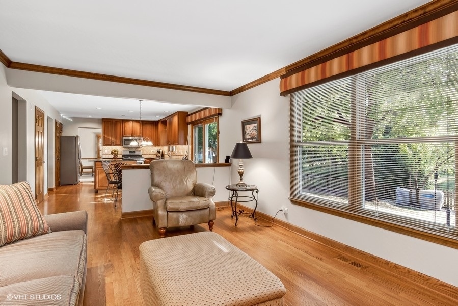 809 Hyde Park Lane Naperville, IL 60565 - Photo 11 of 30 a living room with furniture and a large window