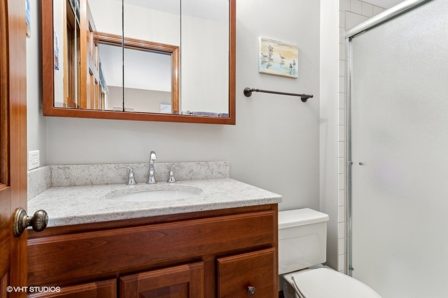 809 Hyde Park Lane Naperville, IL 60565 - Photo 13 of 30 a bathroom with a granite countertop sink and a toilet