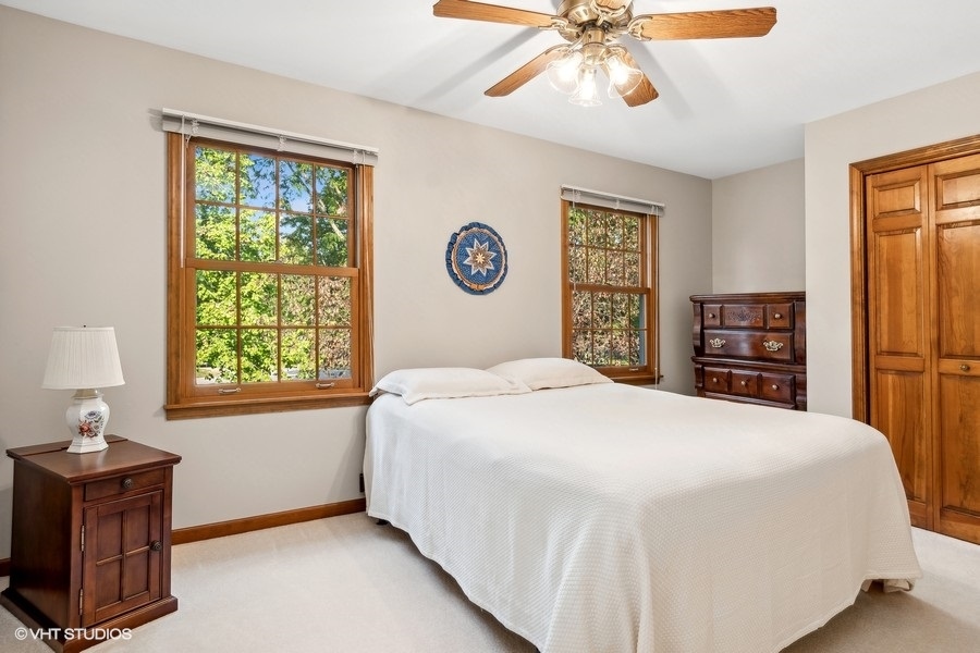 809 Hyde Park Lane Naperville, IL 60565 - Photo 14 of 30 a bedroom with a large bed and a window