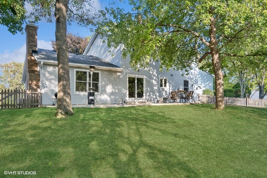 809 Hyde Park Lane Naperville, IL 60565 - Photo 24 of 30 a view of a house with backyard porch and garden