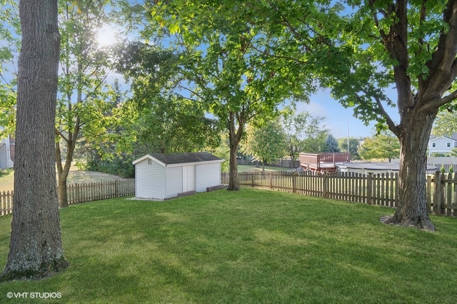 809 Hyde Park Lane Naperville, IL 60565 - Photo 28 of 30 a view of a backyard with a large tree