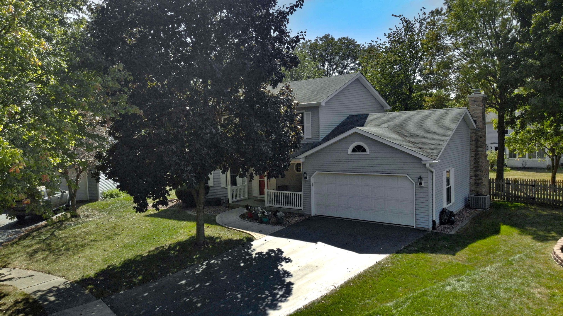 809 Hyde Park Lane Naperville, IL 60565 - Photo 30 of 30 a front view of a house with a yard garage and trees