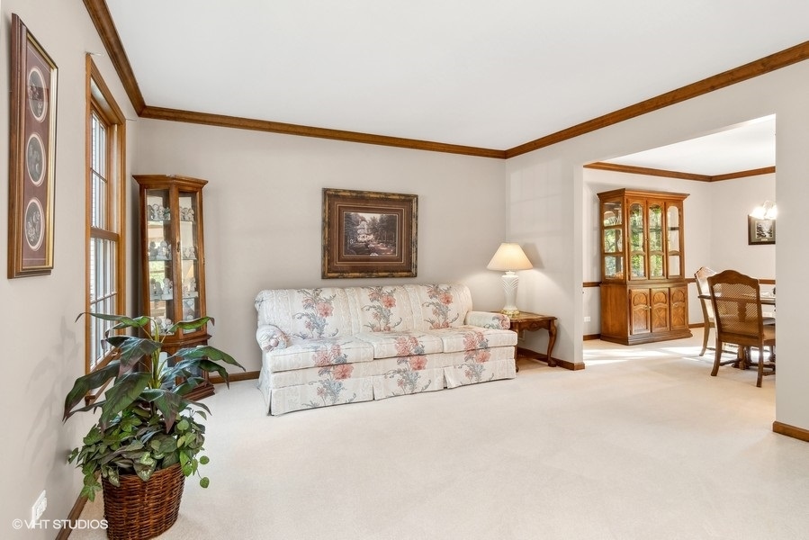 809 Hyde Park Lane Naperville, IL 60565 - Photo 4 of 30 a bed room with a bed and a chair