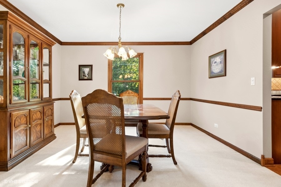 809 Hyde Park Lane Naperville, IL 60565 - Photo 8 of 30 a view of a dining room with furniture window and outside view
