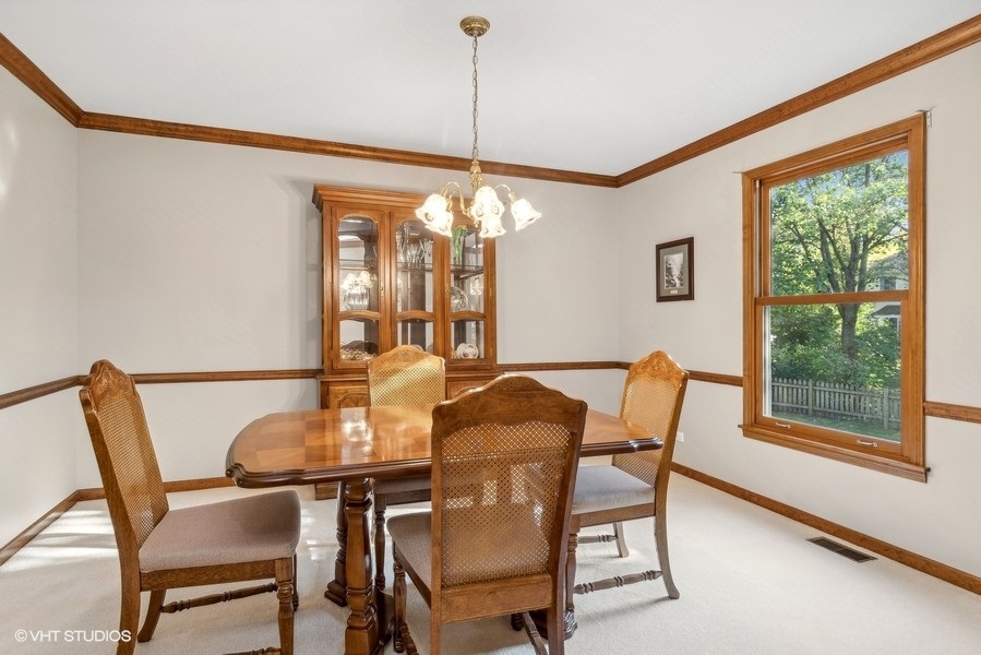 809 Hyde Park Lane Naperville, IL 60565 - Photo 9 of 30 a dining room with furniture and window