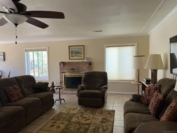 a view of a dining room that has a table and chairs