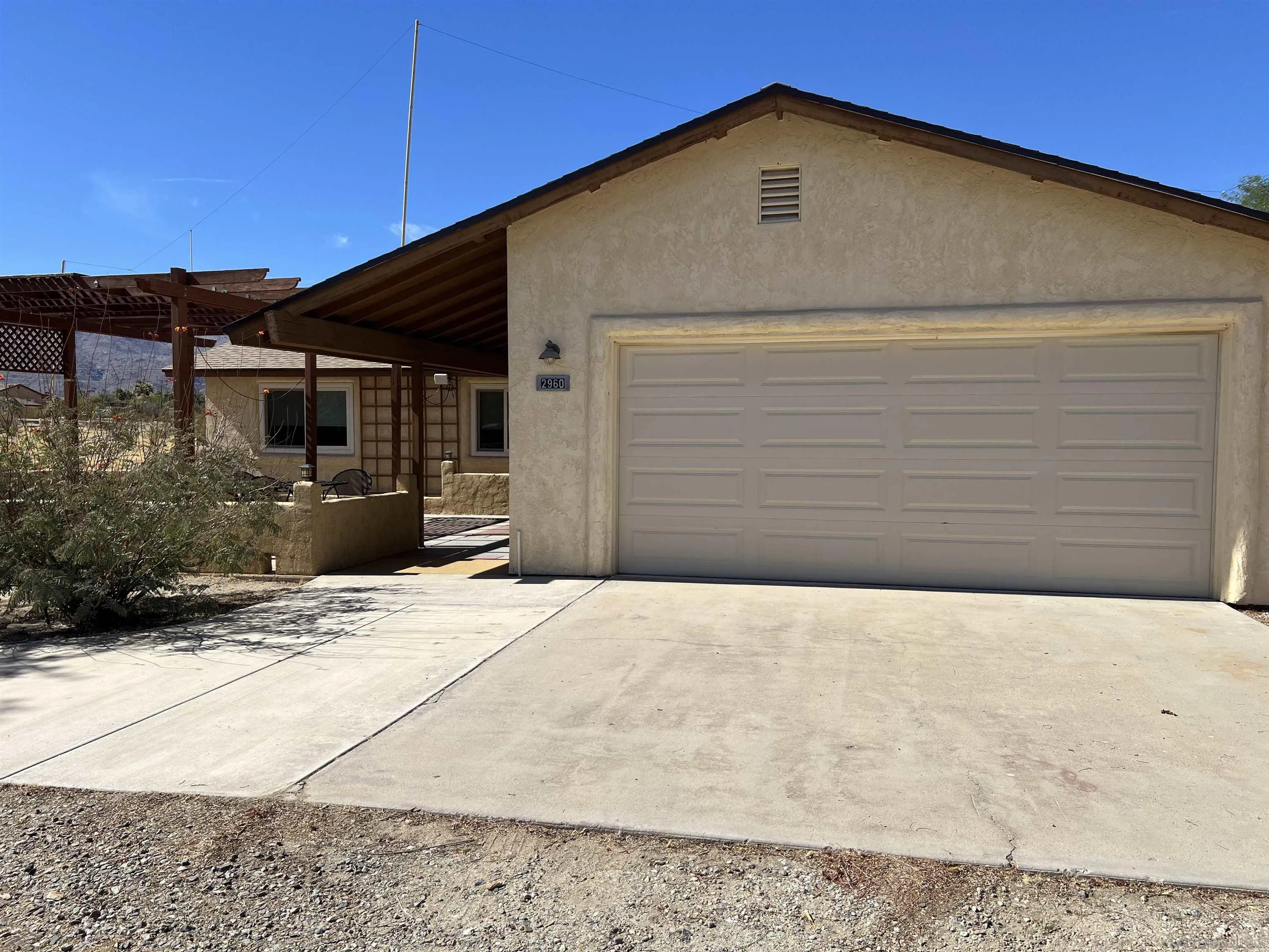 2960 Frying Pan Road Borrego Springs, CA 92004 - Photo 2 of 27 a front view of a house with a yard