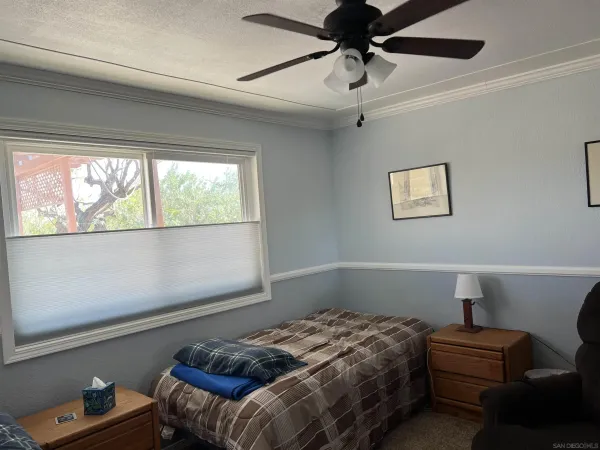 a living room with a couch and a window