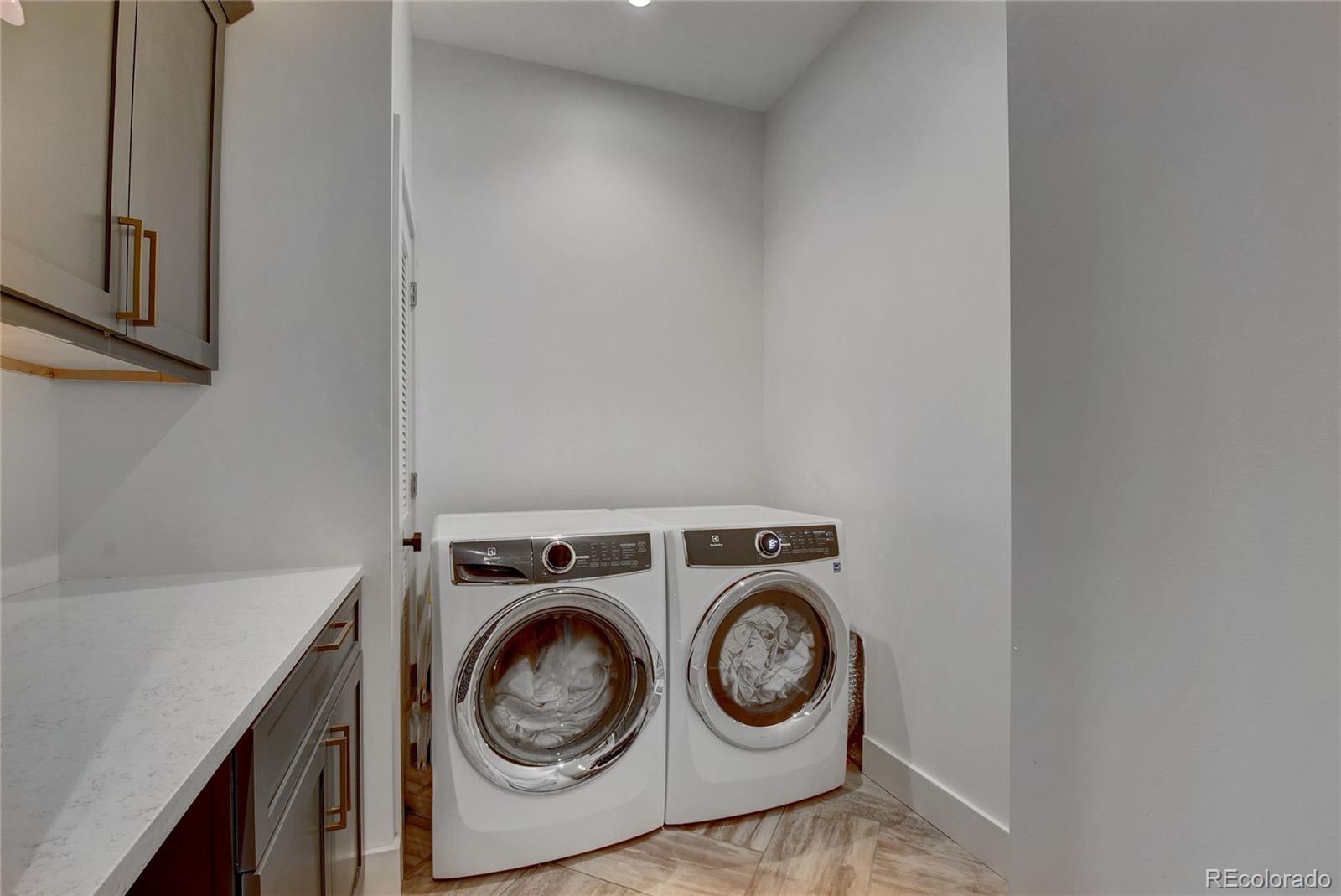 5151 West Wagon Trail Road Littleton, CO 80123 - Photo 25 of 37 a utility room with dryer and washer