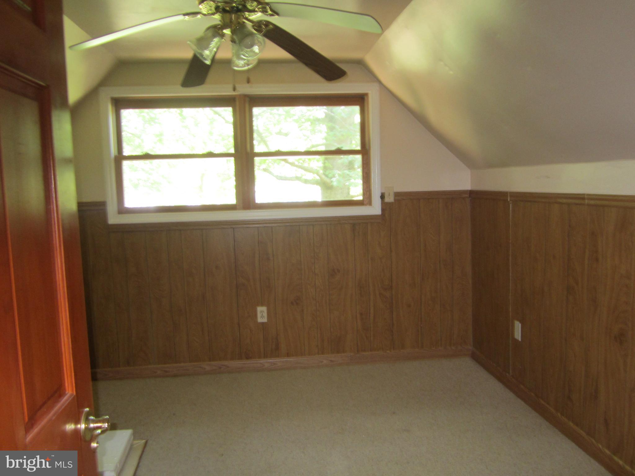 3421 Holland Cliffs Road Huntingtown, MD 20639 - Photo 15 of 19 a view of an empty room with a window