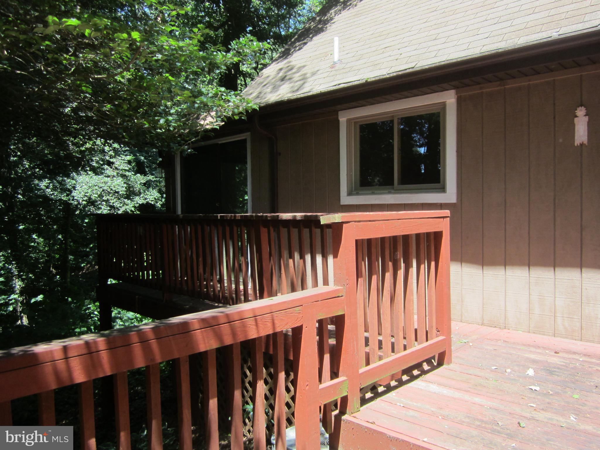 3421 Holland Cliffs Road Huntingtown, MD 20639 - Photo 17 of 19 a view of a house with backyard and wooden fence