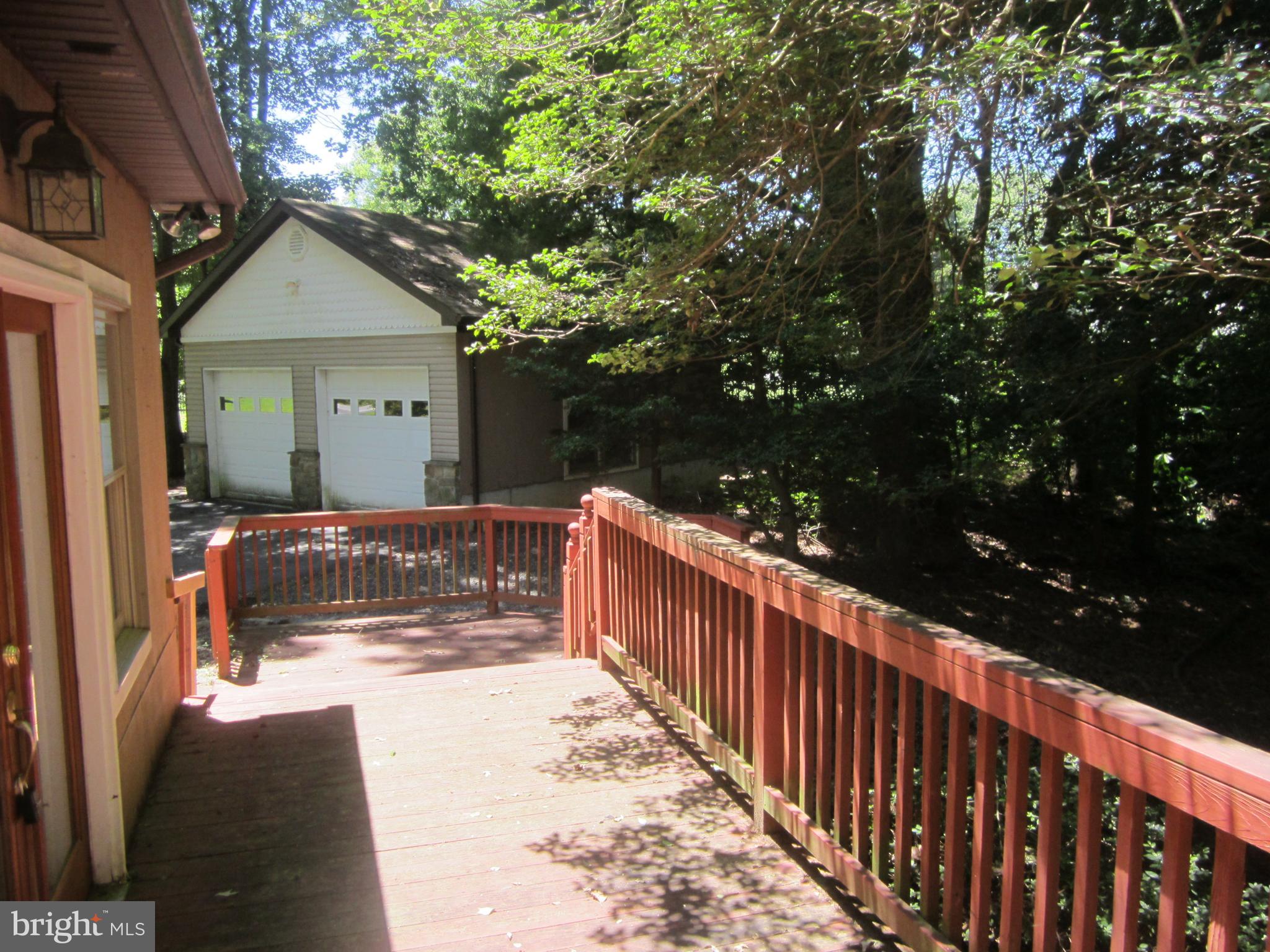 3421 Holland Cliffs Road Huntingtown, MD 20639 - Photo 18 of 19 a view of house with wooden fence