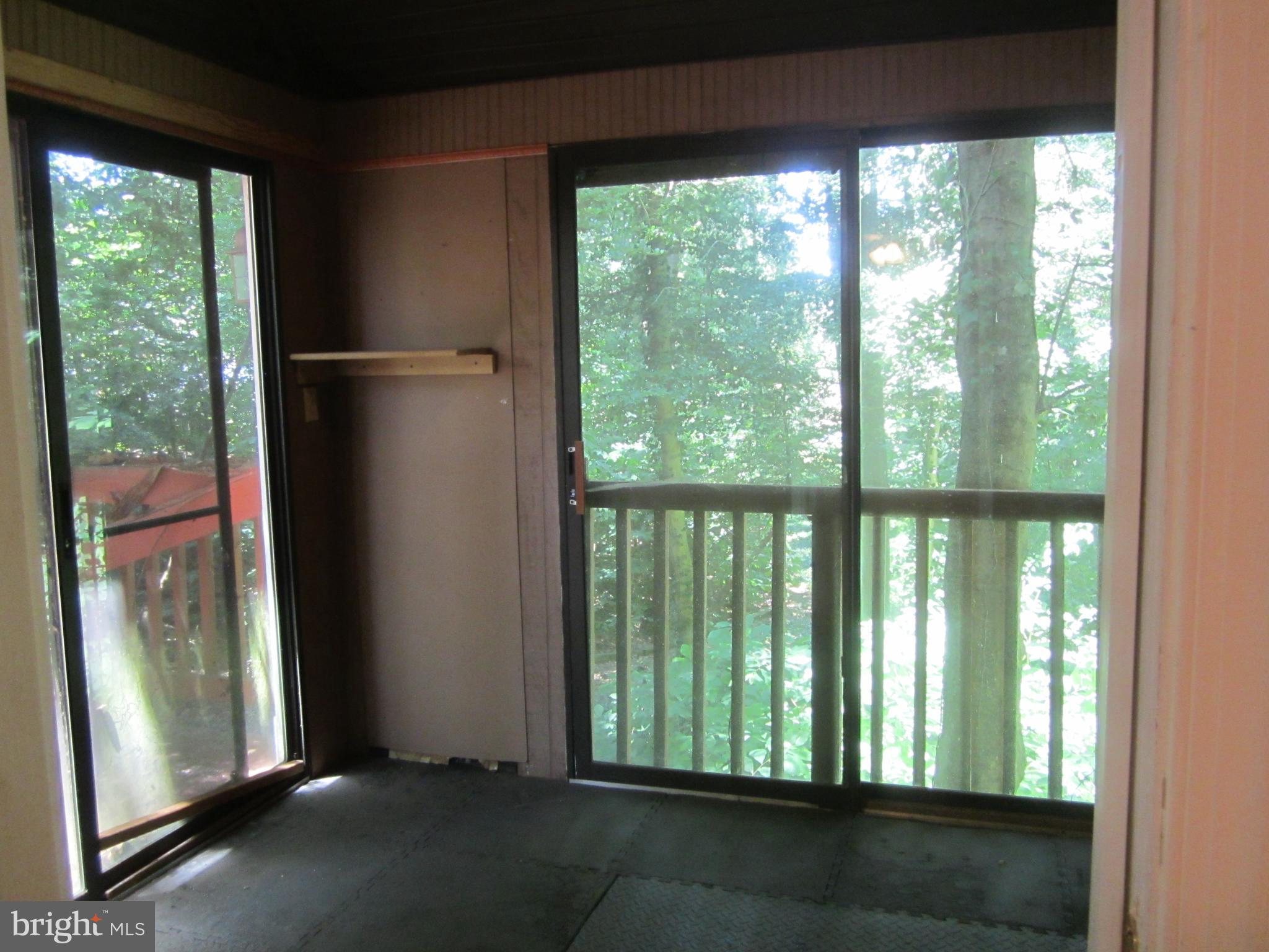 3421 Holland Cliffs Road Huntingtown, MD 20639 - Photo 9 of 19 a view of a room that has a large window