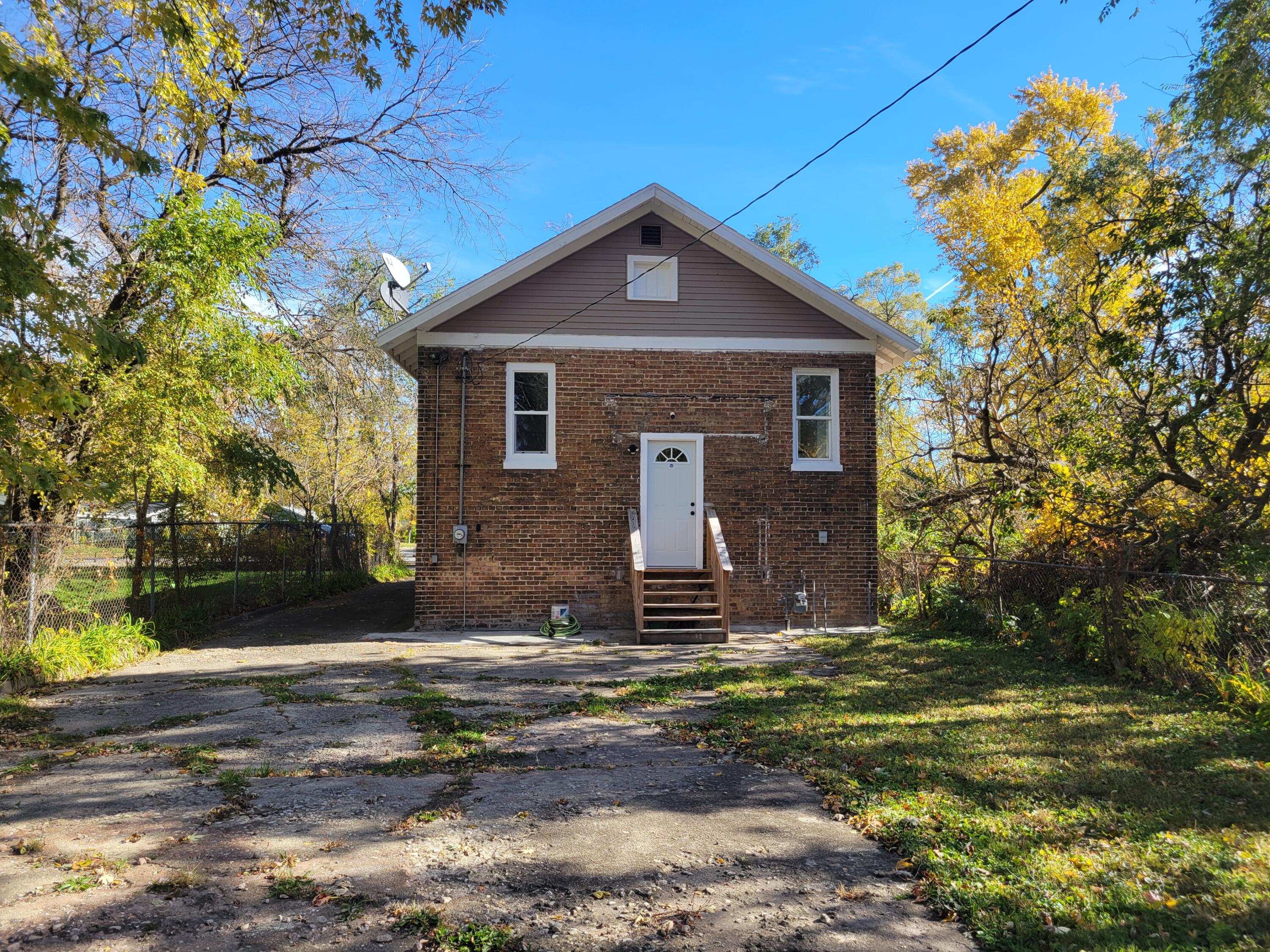 4738 Delaware Street Gary, IN 46409 - Photo 13 of 14 a front view of house with yard