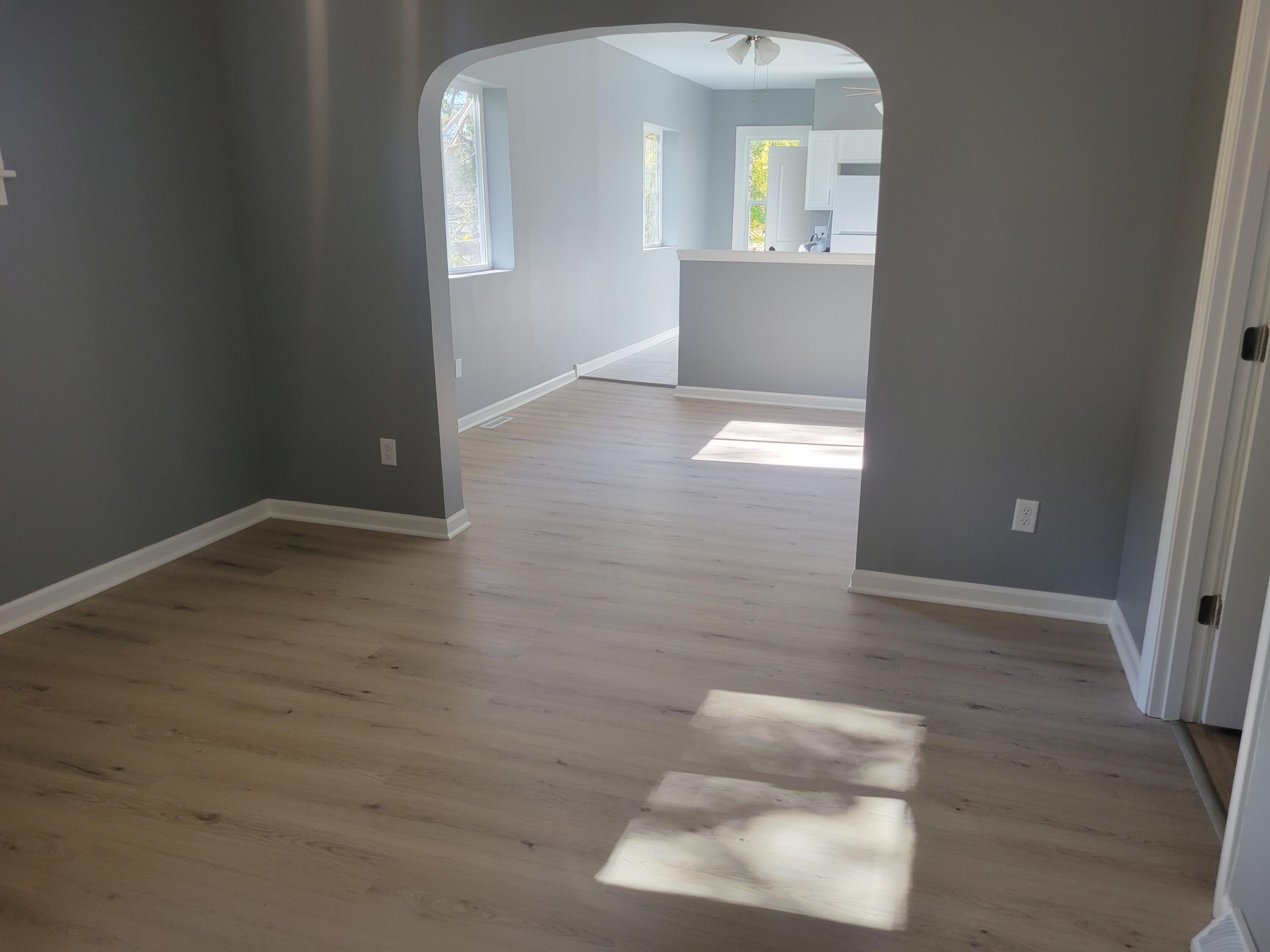 4738 Delaware Street Gary, IN 46409 - Photo 2 of 14 wooden floor in a hall with a window